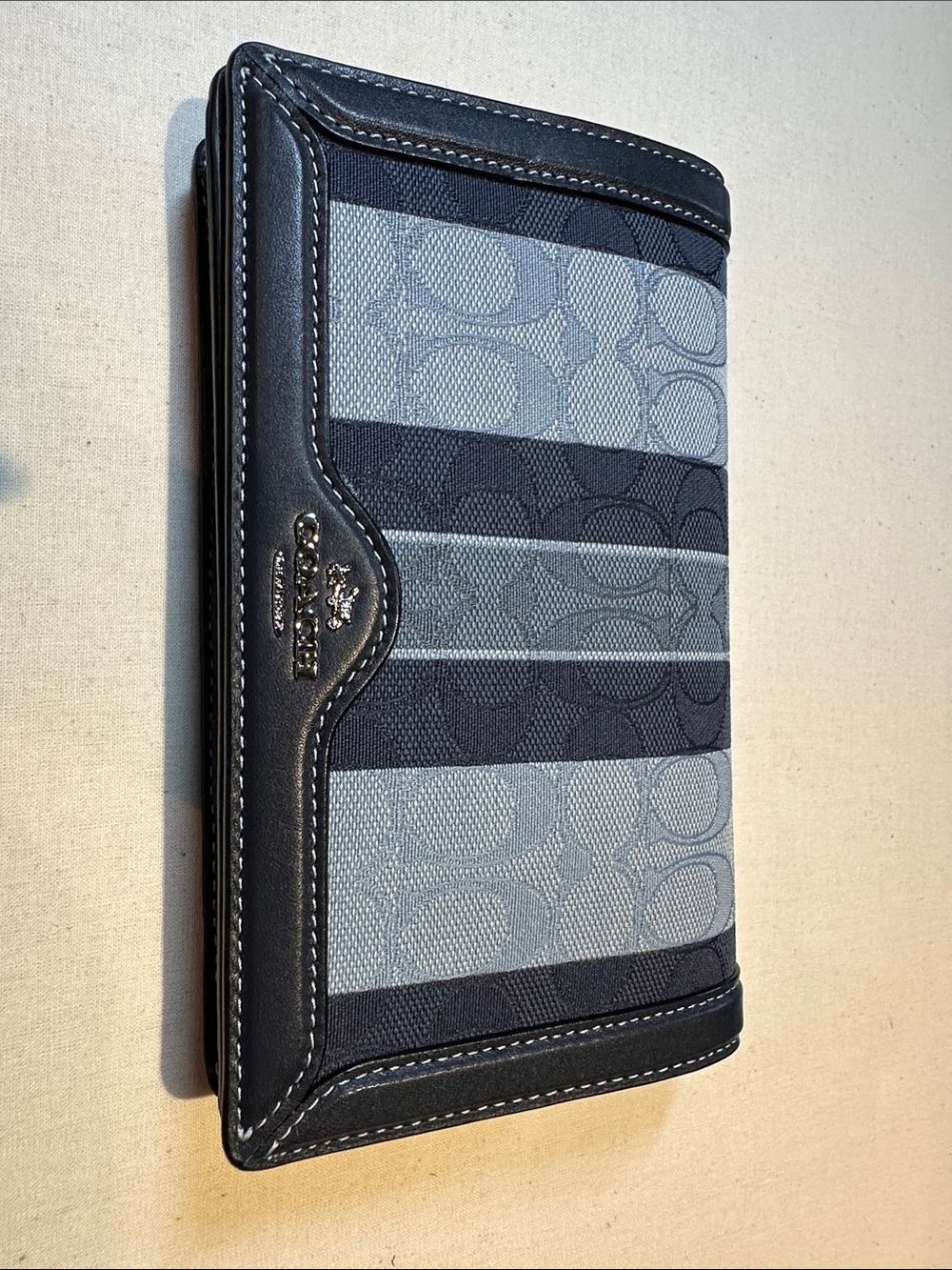 Coach Womenβs Jacquard/Leather Navy/Light Blue Signature Stripe Crossbody Clutch